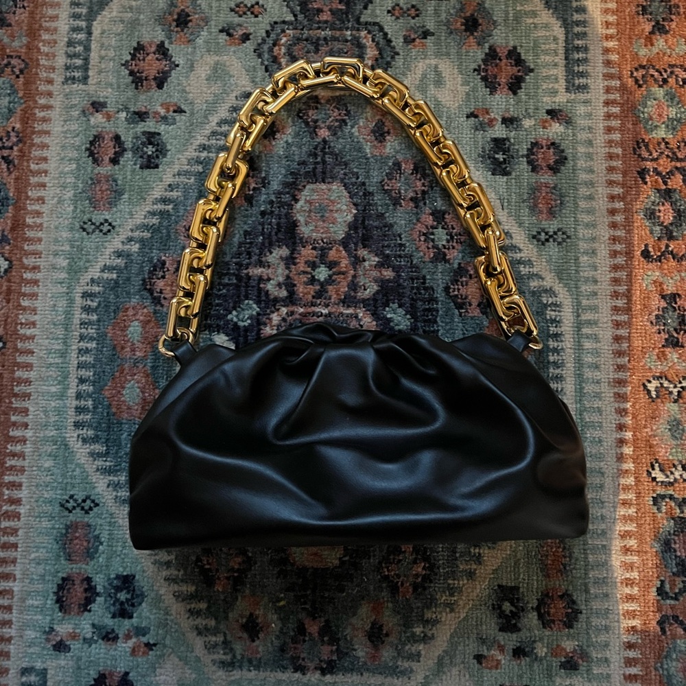 black puff purse with plastic chain